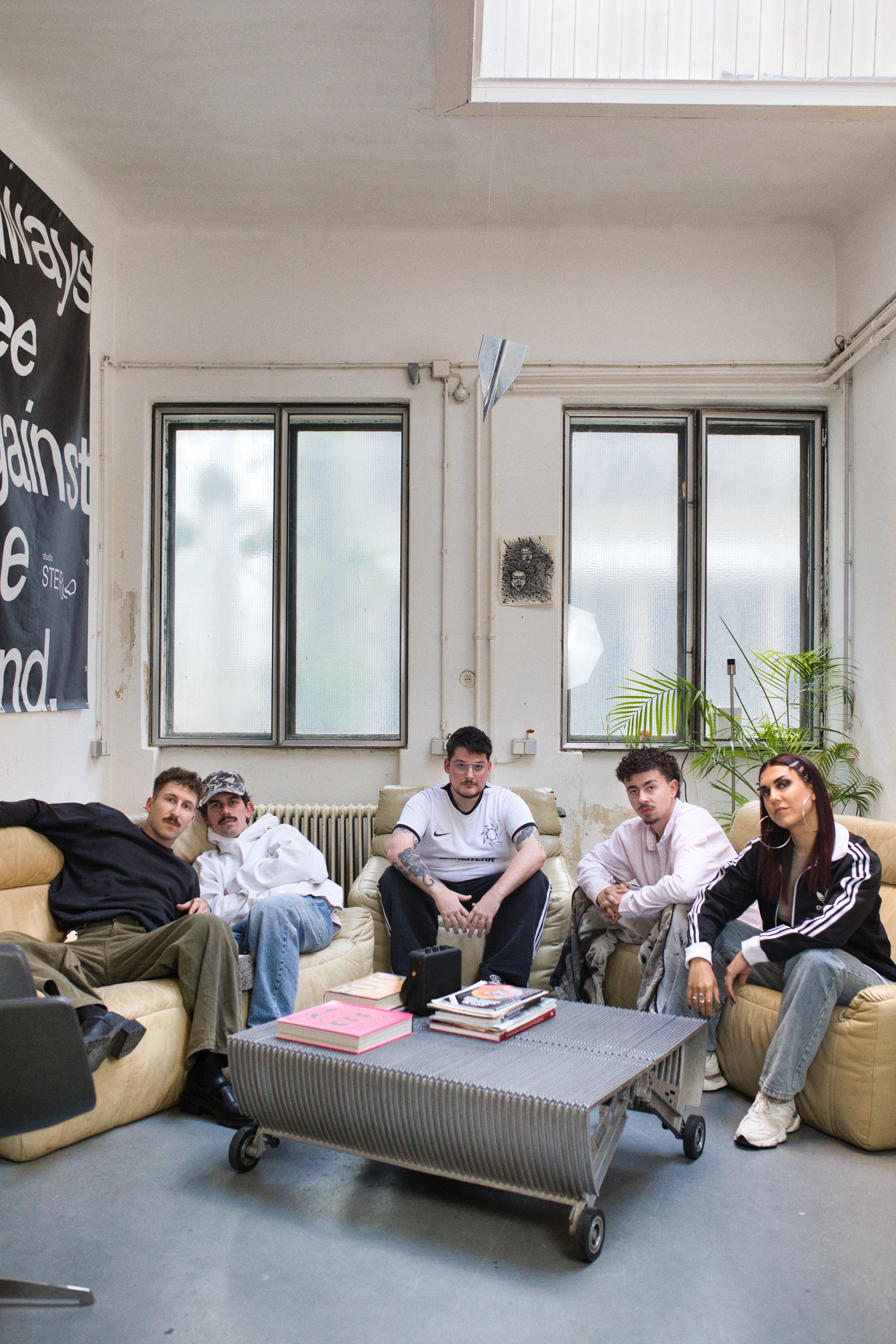 MAHLWERK artists sitting together in a studio space